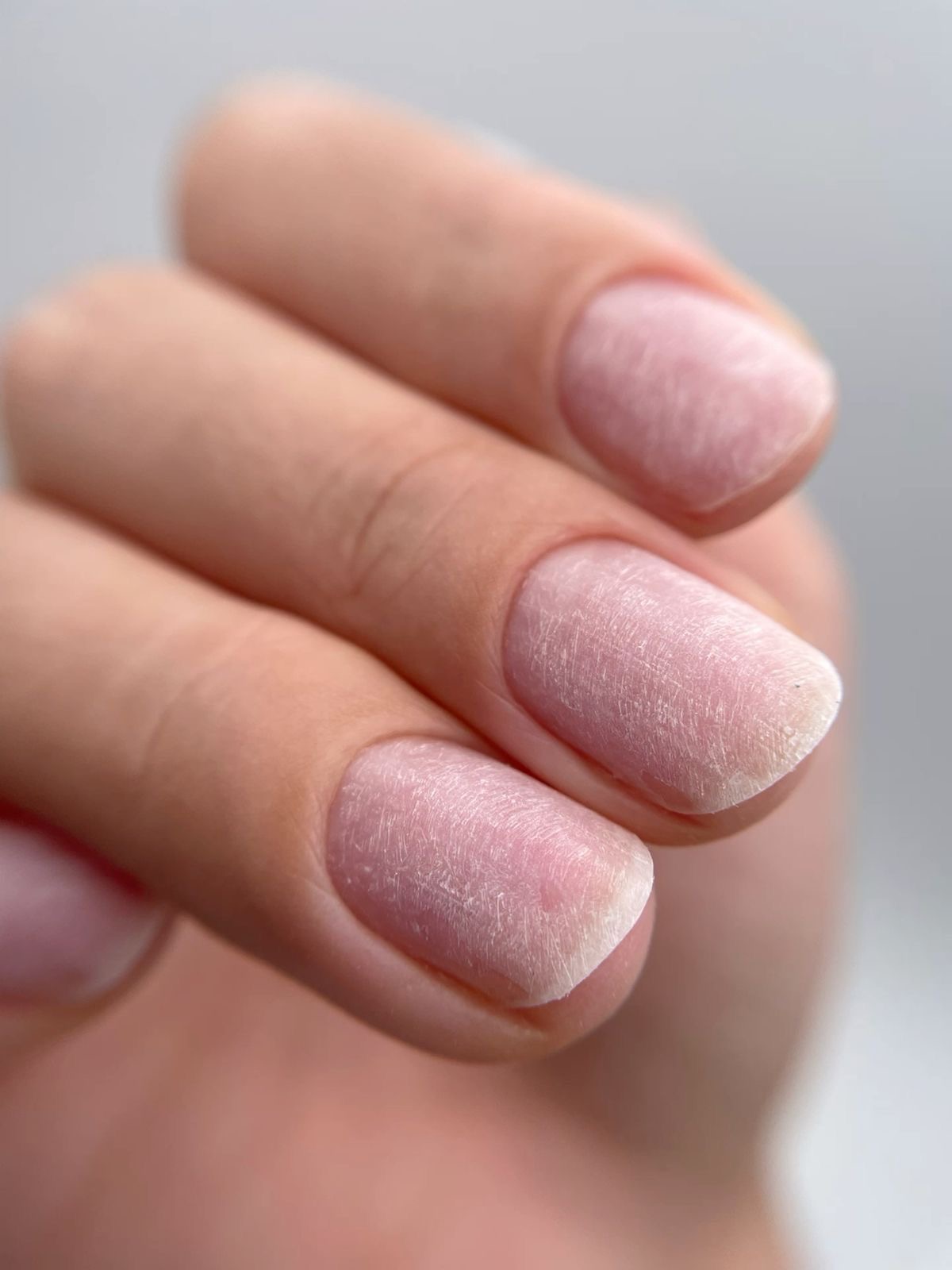 Red almond gel nails by a Glossed Academy student